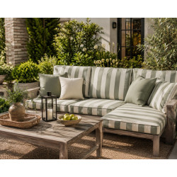 Patio with furniture upholstered in sage and white fabric