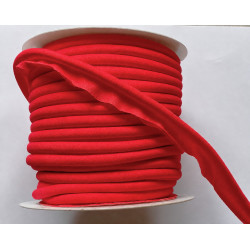 A full reel of plain, Red flanged piping cord on white background