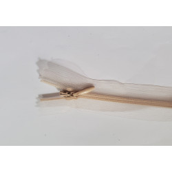 closed-end invisible zip- transparent- nude - 50cm, placed on a white background, close up on detail