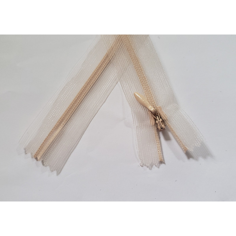 closed-end invisible zip- transparent- nude - 25cm, placed on a white background