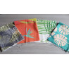 Cotton canvas remnants bundle - tropical designs - 4 pieces, placed on a grey table
