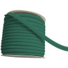 A full reel of plain, fern green flanged piping cord on a white background