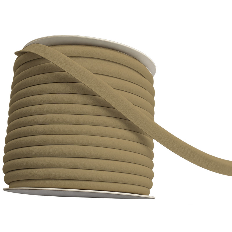 A full reel of plain, caramel beige flanged piping cord on a white background