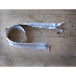 double slider zip - light grey - 50cm, placed on a wooden background