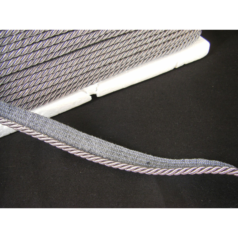 Flanged piping cord  in dark grey color, 5mm wide piping , full reel on black background
