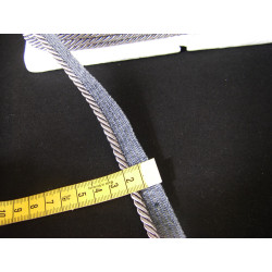 Flanged piping cord  in dark grey color, 5mm wide piping , full reel on black background with the ruler