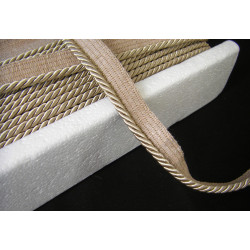 Flanged piping cord  in beige sand color, 5mm wide piping , full reel on the table