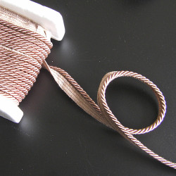 Flanged piping cord  in dark beige color, 5mm wide piping , full reel on the table