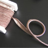 Flanged piping cord  in dark beige color, 5mm wide piping , full reel on the table
