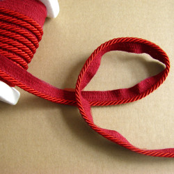 Flanged piping cord  in wine color, 5mm wide piping , full reel on the table