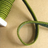 Flanged rope  piping cord 5mm wide, intense olive color, full reel on the wooden table