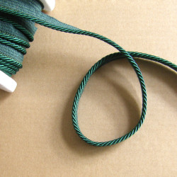Flanged rope  piping cord 5mm wide, navy color, full reel on the wooden table