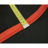 Twisted flanged piping cord 7mm wide in red on black background with the ruler