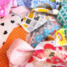 100% Cotton fabric offcuts bundle, a random set of patterns placed on the table