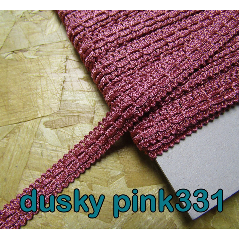 Upholstery braid, 15mm wide  in  dusky pink color, full reel across the table