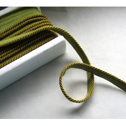 Flanged rope  piping cord 5mm wide, chartreuse color, full reel on the wooden table