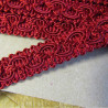 Upholstery braid, 18mm wide  in  dark red color, full reel across the table