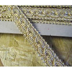 Upholstery braid, 18mm wide  in light beige color, full reel across the table