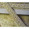 Upholstery braid, 18mm wide  in light beige color, full reel across the table