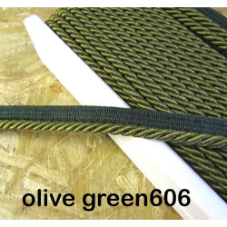 Twisted flanged piping cord 7mm wide in olive color from the reel on a wooden table