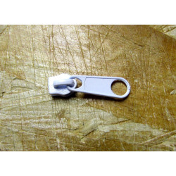 zip slider-coil size 5  with long puller in white color. Non lock type slider for nylon zips in size 5