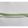 Plain, light green flanged piping cord on white background