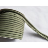 A full reel of plain, olive green flanged piping cord on white background