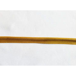 Plain, ochre flanged piping cord on white background