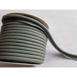 A full reel of plain, grey flanged piping cord on white background