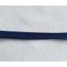 Plain, navy blue flanged piping cord on white background