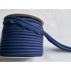 A full reel of plain, navy blue flanged piping cord on white background