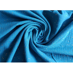 Double gauze fabric with gold speckles - 100% cotton fabric in intense sea blue color twisted the table