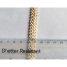 Scroll upholstery braid, 9mm wide  in  natural color, with the ruler