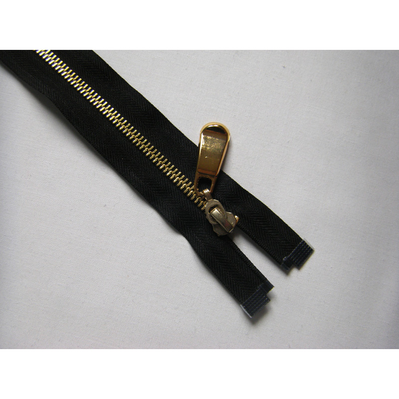 open-ended metal zip, gold teeth color , single zip on white background