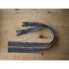 Open-ended metal zip in  dark grey, color, 50cm long - Antique brass, two zips on the wooden table