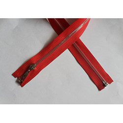 Open-ended plastic zip with a metal look  in red color, 60cm long - nickel, on the white background