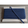 Scroll upholstery braid, 9mm wide  in  frost blue color, full reel on grey background