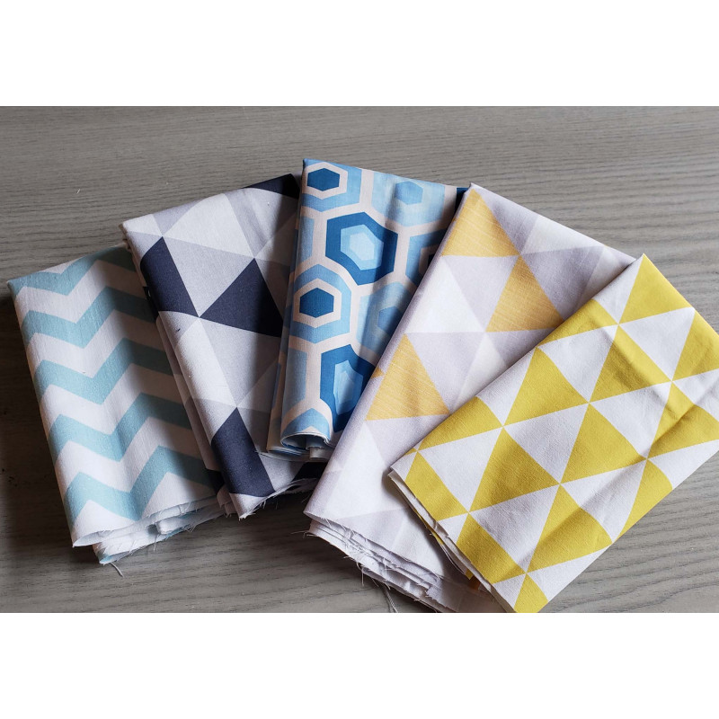 Cotton fabric remnants bundle , set of geometric patterns, placed on grey table