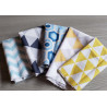 Cotton fabric remnants bundle , set of geometric patterns, placed on grey table