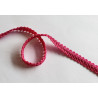 Silky gimp braid 9mm - scroll - fuchsia, twisted on the white background