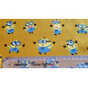 Little Minions on mustard - medium cotton fabric, the capture with measuring tape