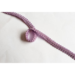 Silky gimp braid 9mm - scroll - lilac color, twisted on the white background