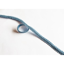Upholstery braid, 9mm wide  in light blue color, close up on the braid