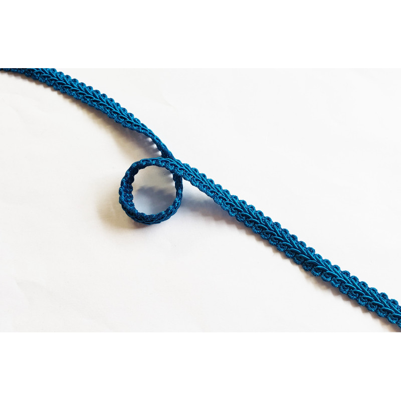 Upholstery braid, 9mm wide in intense turquoise color, close up on the braid Upholstery braid, 9mm wide in intense turquoise color, close up on the braid