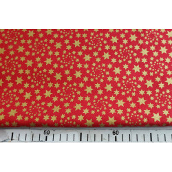 Metallic gold stars on red background - 100% Cotton fabric, the capture with measuring tape