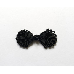 Chinese frog fastener in black color on white background