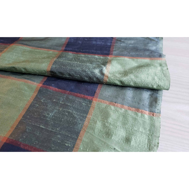 Dupion silk fabric - large check in navy and green color, the capture of fabric with the fold across the image