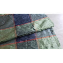 Dupion silk fabric - large check in navy and green color, the capture of fabric with the fold across the image