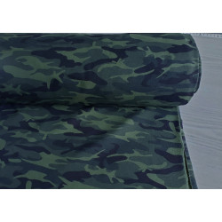Camouflage in dark green - cotton french terry jersey fabric, the roll of fabric on a grey table