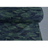 Camouflage in dark green - cotton french terry jersey fabric, the roll of fabric on a grey table